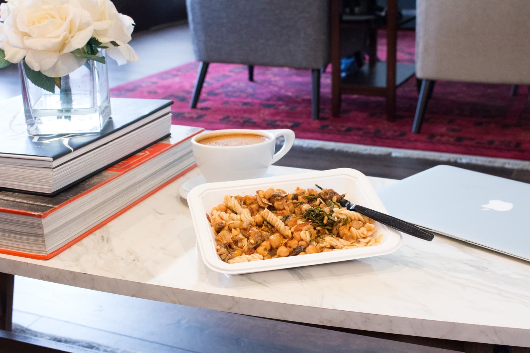 Organized meal prep containers arranged for office delivery planning